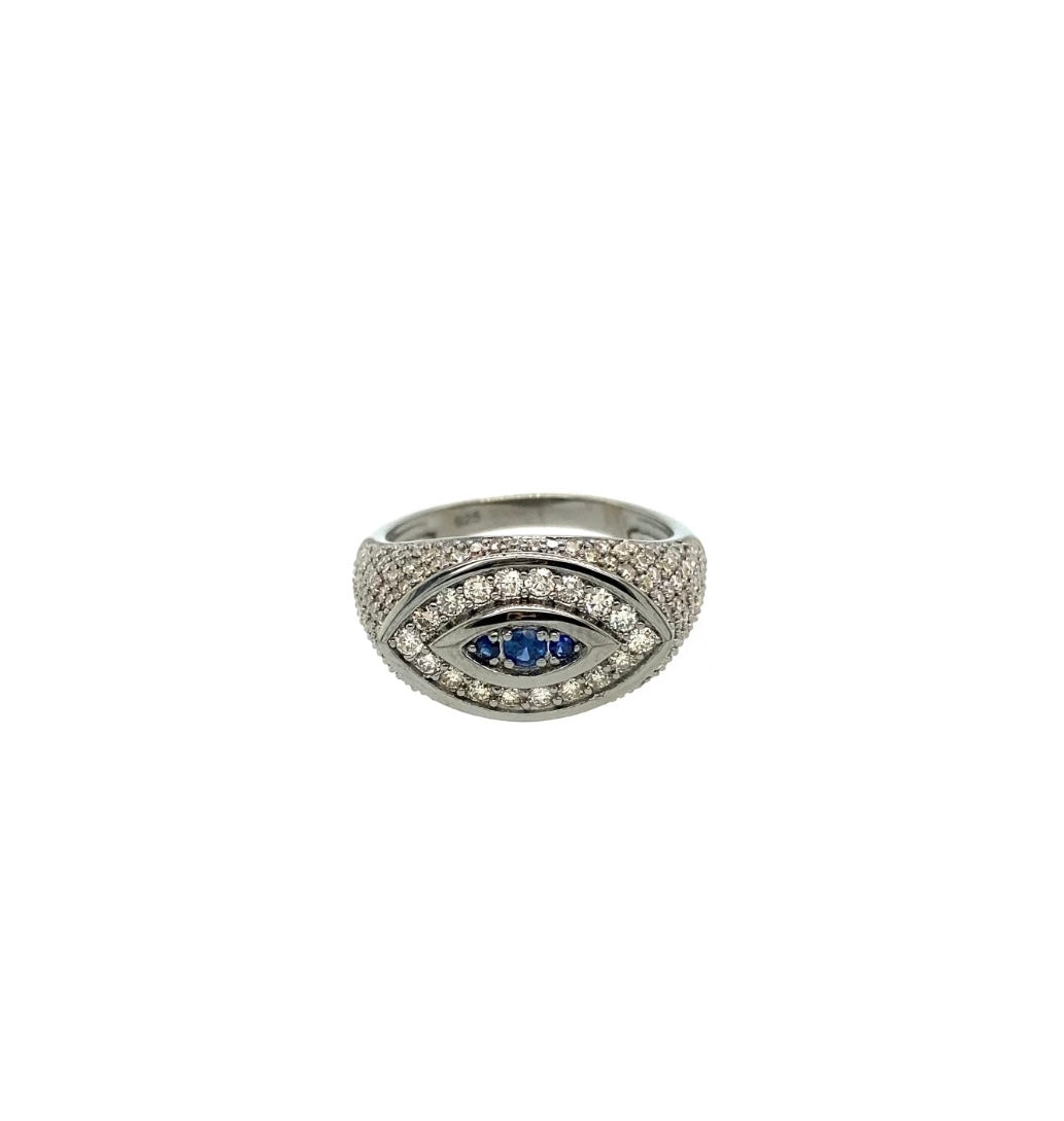 evil ring is surrounded by diamonds and sapphires. Set in sterling silver